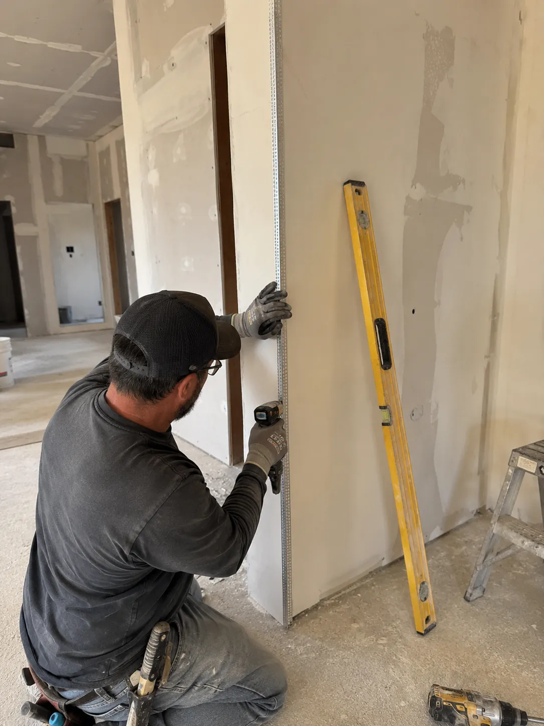Installing metal corner bead on an outside drywall corner