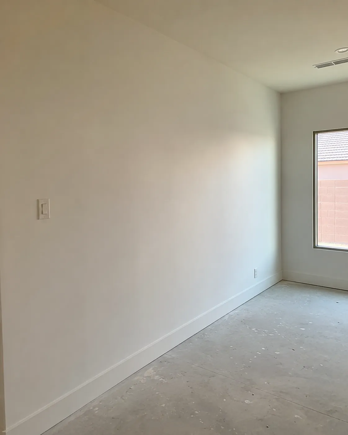 Smoothly finished and primed drywall wall ready for paint